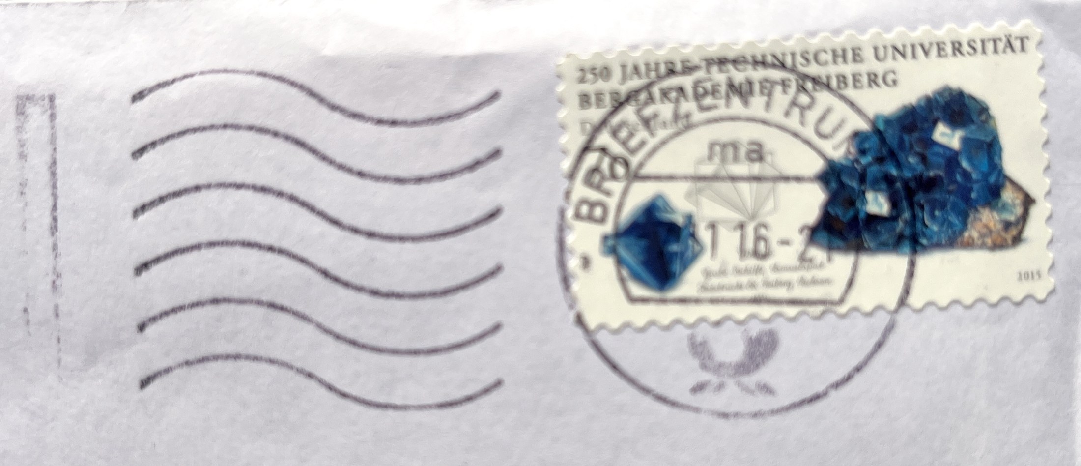 Umschlag: Briefmarke „250 Jahre Technische Universität Bergakademie Freiberg“ und Maschinenstempel des Briefzentrums, November 2016