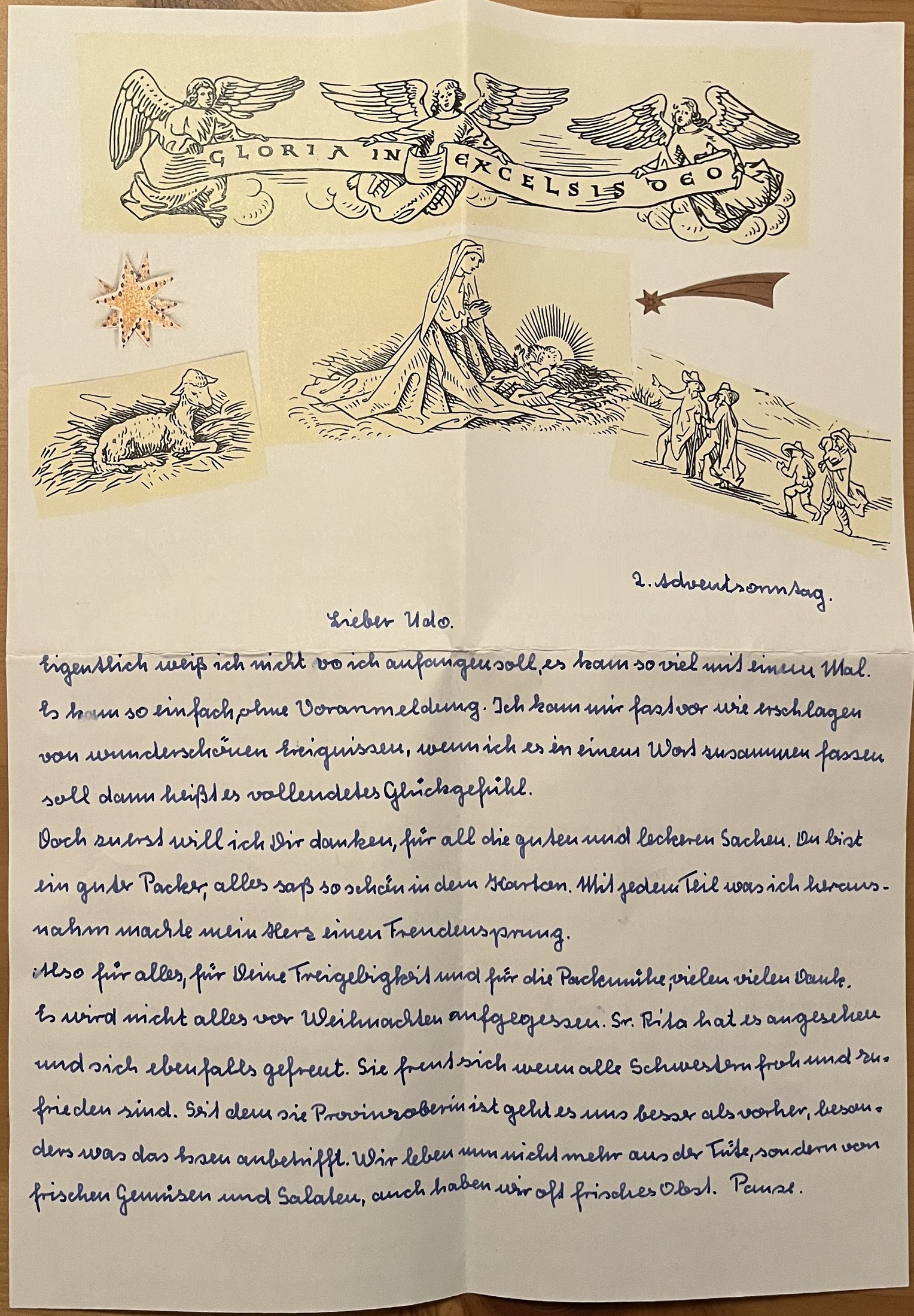 Erste Seite mit aufgeklebten Bildern zur Weihnachtsgeschichte und dem Schriftband Gloria in excelsis Deo