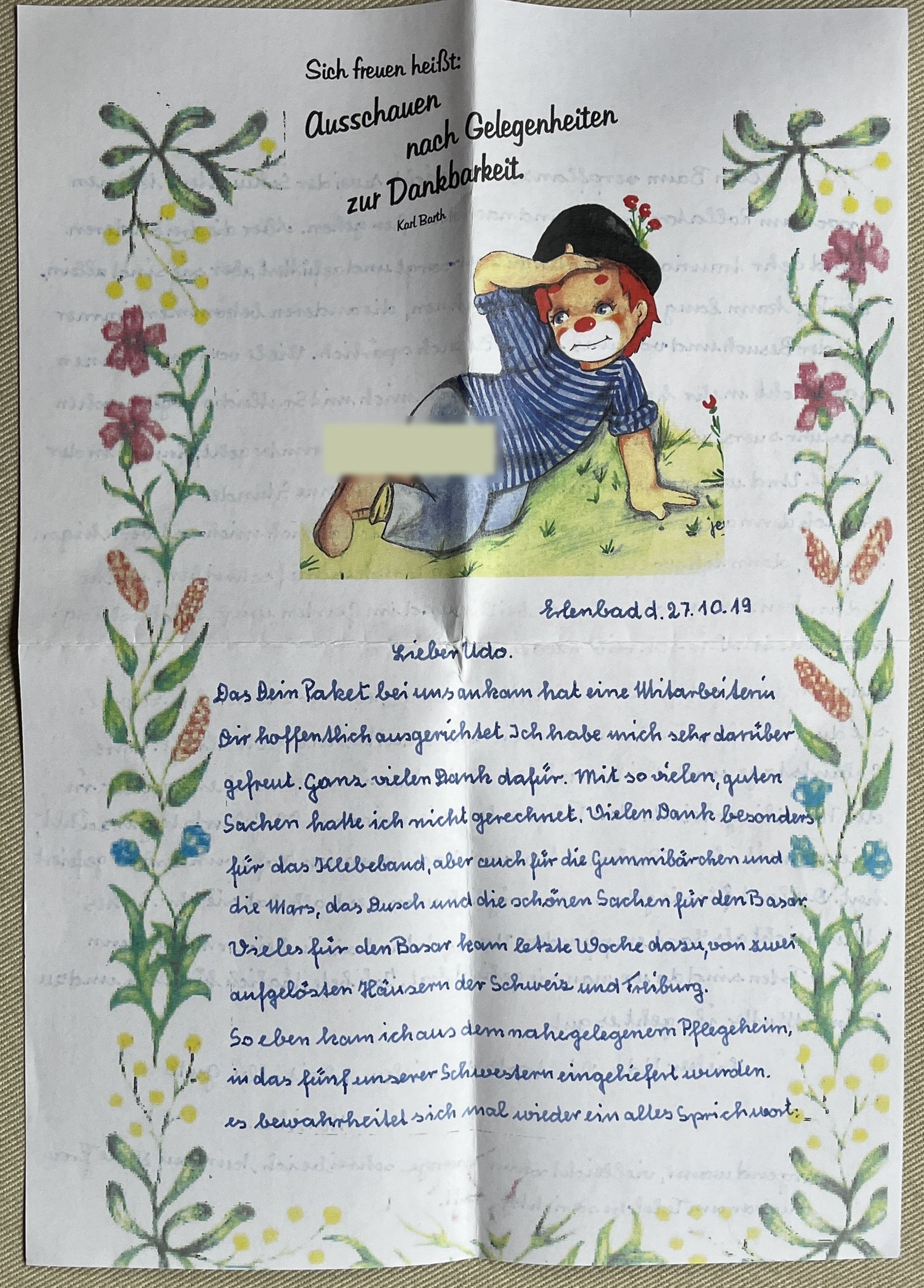 Erste Seite mit Blumenbordüren, Karl-Barth-Wort und Clownsjungen